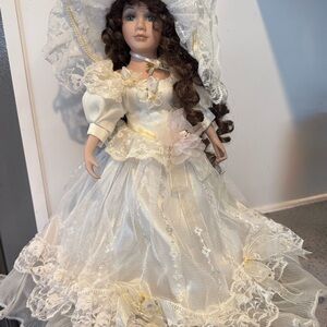 Vintage collectible Victorian wedding porcelain doll with brown curls